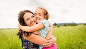 Mother and child hugging