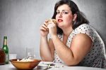 obese-woman-eating-junk-food
